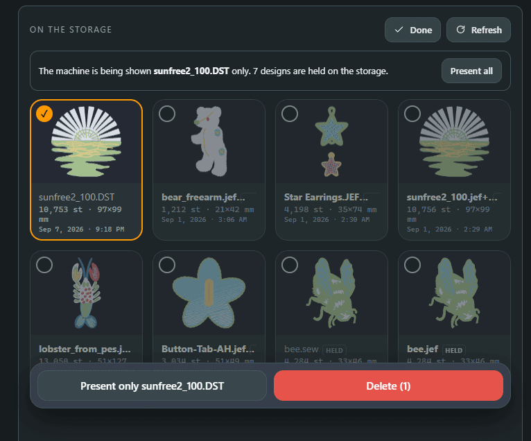 The app's On the storage panel: one design ticked to present, with Present only and Delete offered, and the other designs held back from the machine